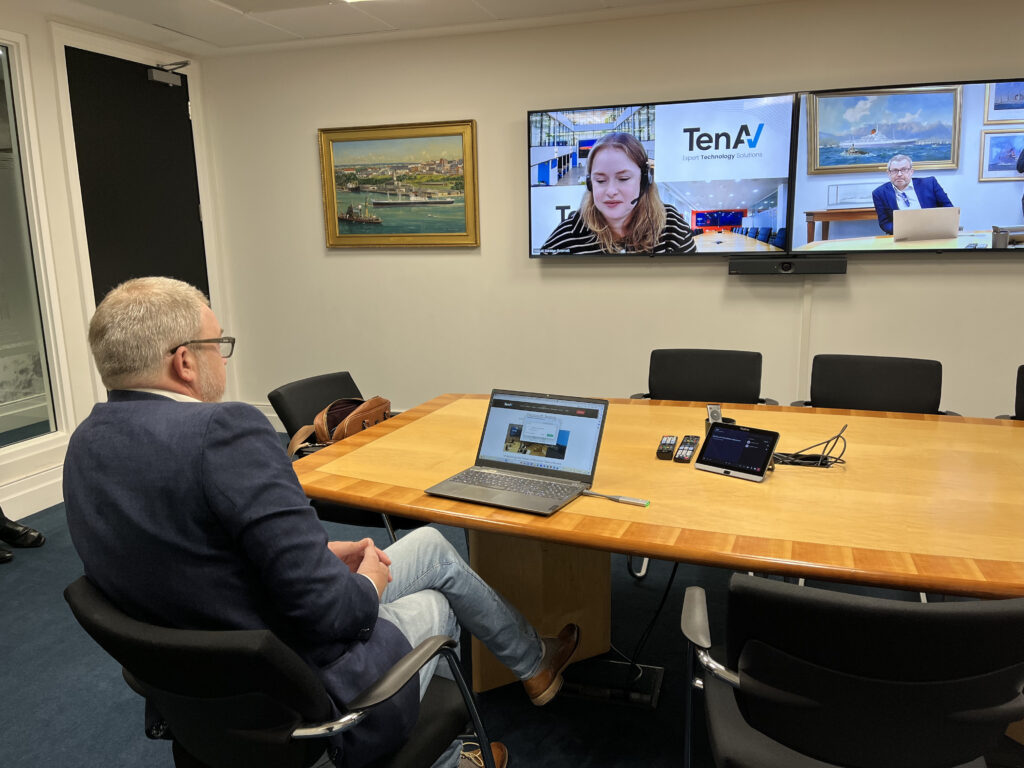 two people using recently installed meeting room upgrades
